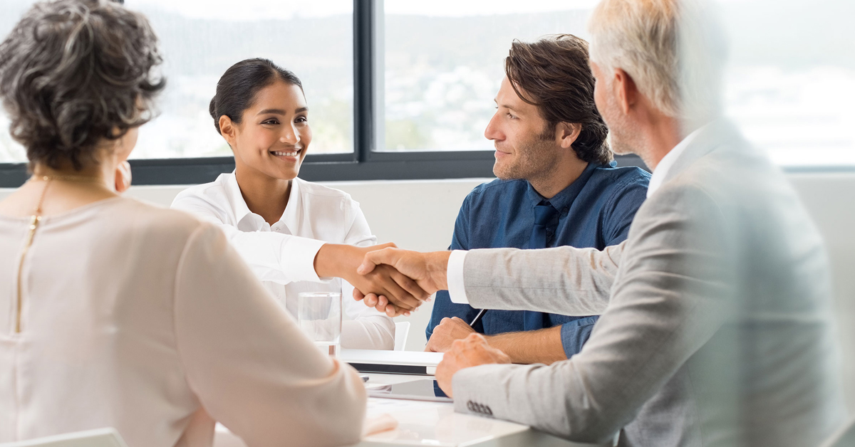 Business people in a meeting shaking hands