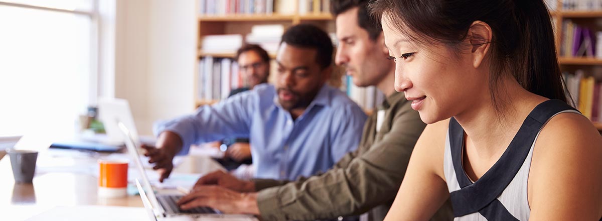Four students working at computers