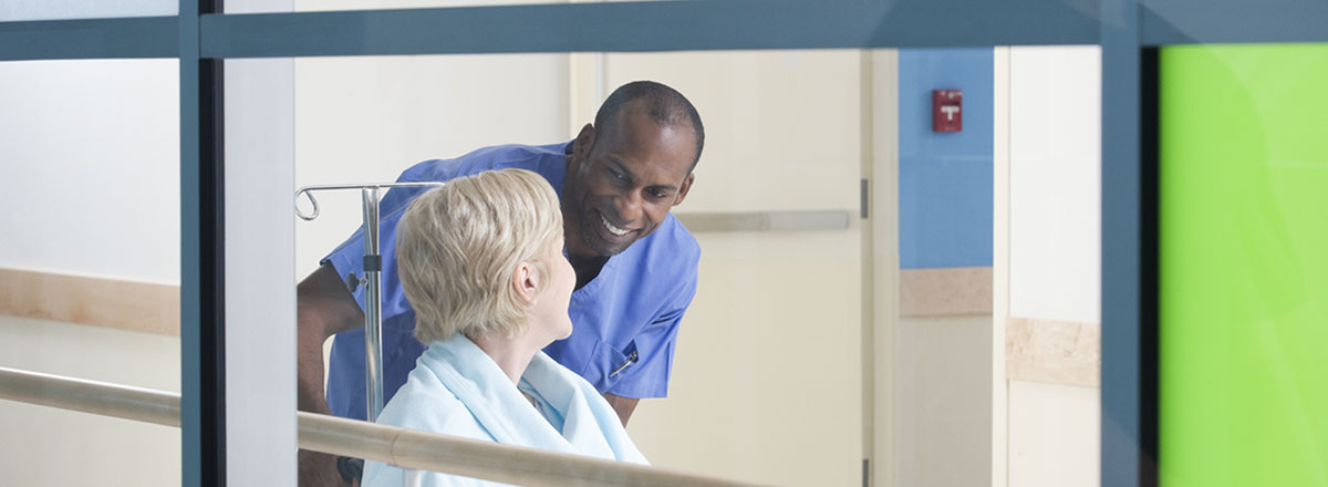 Norse helping patient in wheelchair