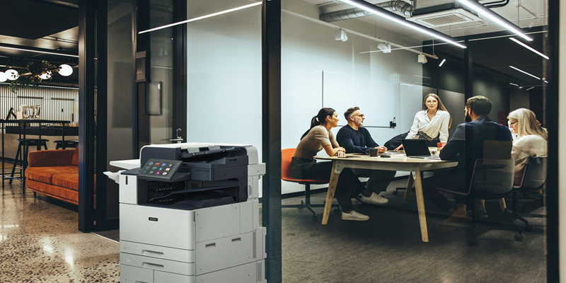 AltaLink printer in front of a conference room.
